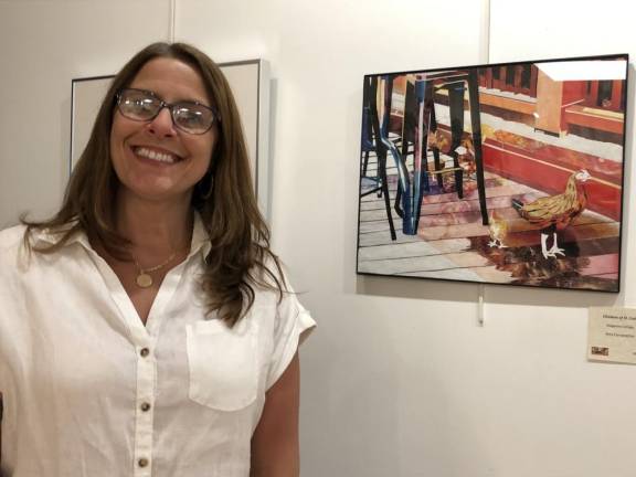 Amy Fairweather, who teaches art at Wallkill Valley Regional High School, poses by one of her works.