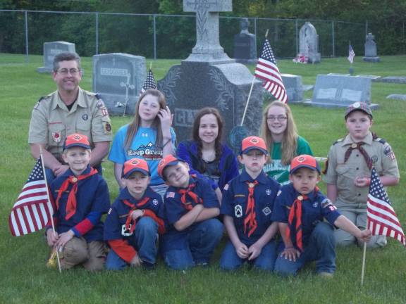 Ogdensburg Cub Scout Pack 89 and Girl Scout Troop 674 placed flags at St Thomas cemetery to honor the fallen soldiers for Memorial Day.