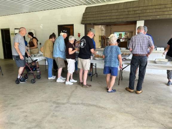 PC1 People line up for a barbecue lunch at the 10th annual veterans picnic, hosted by Sussex County Division of Senior Services, on Saturday, Aug. 19. (Photos by Daniele Sciuto)