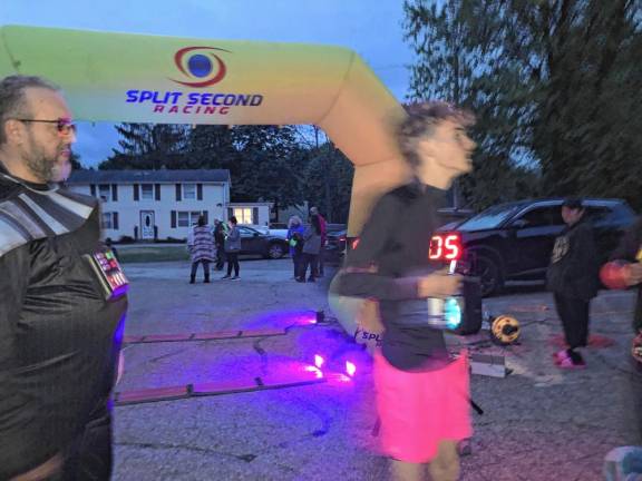 Michael Gibson, 14, wins the 5K with a time of 19:05.6. It was the first 5K run by the freshman, who is on the track team at Wallkill Valley Regional High School.