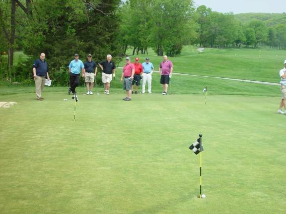 Photo courtesy John T. Whiting A second ace is holed.