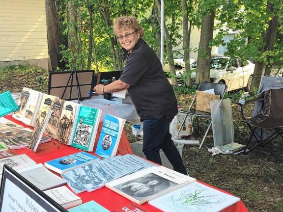 Sharon Spangenberg of the Walpack Township Historical Society sells local and regional history books at the Sussex County History Day last year. (Photo courtesy of Wayne T. McCabe)