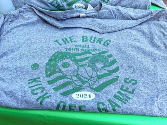 The Ogdensburg Historical Society is selling T-shirts. The proceeds will go to two charities supported by the late John Kibildis.