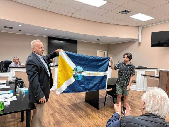 JM1 Jefferson Mayor Eric Wilsusen and Jack Murphy hold the township flag designed by the teen. (Photos provided)