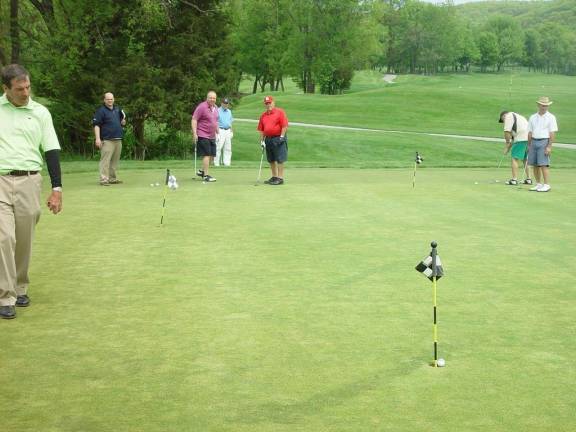 Photo courtesy John T. Whiting Tony Panzica becomes the third qualifier to sink an ace in the Putting Contest.