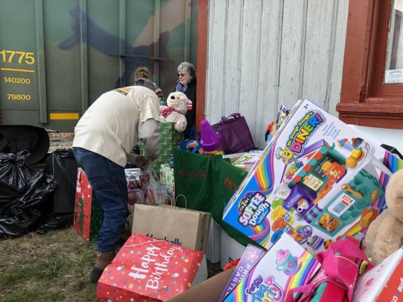 Volunteers pack up donated toys.