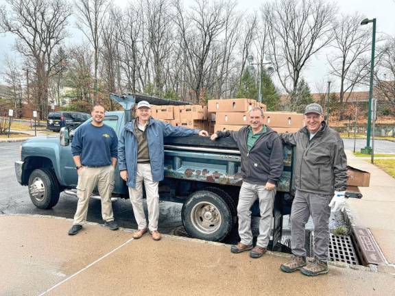 <b>From left are Matt Berke of Project Self-Sufficiency; Chuck Roberts, Lake Mohawk Golf Club president; Andy Frye of Project Self-Sufficiency; and volunteer Michael McNamara. (Photo provided)</b>