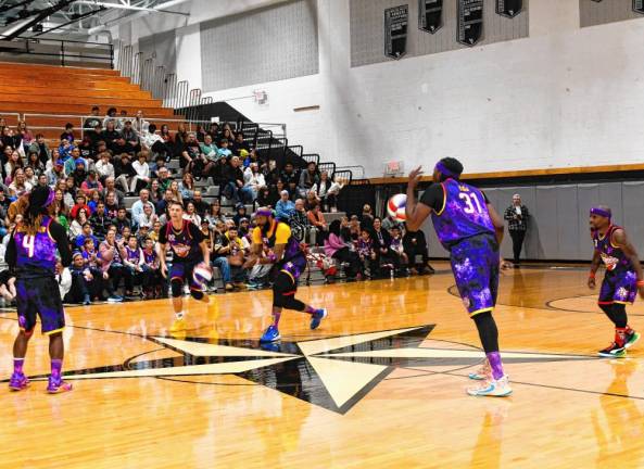 The Harlem Wizards warm up before the game.