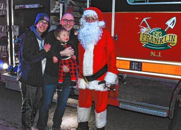 Kayhla, Rhys and Colby Bird of Franklin pose with Santa.