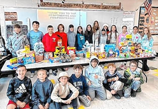 Sixth-grade students at Macopin Middle School in West Milford with items they collected for first-responders fighting the wildfires. (Photo provided)