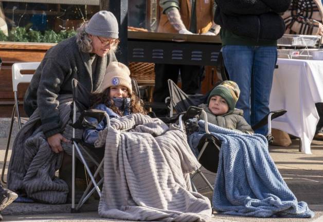 Marsha Letizia of Highland Lakes talks to her grandchildren Chloe Shenfeld, 8, of Demarest and Chloe’s brother Simon, 5. Their grandfather was marching in the parade.