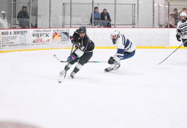 KJS United’s Eddy Brown steers the puck. He scored one goal in the game against Chatham.