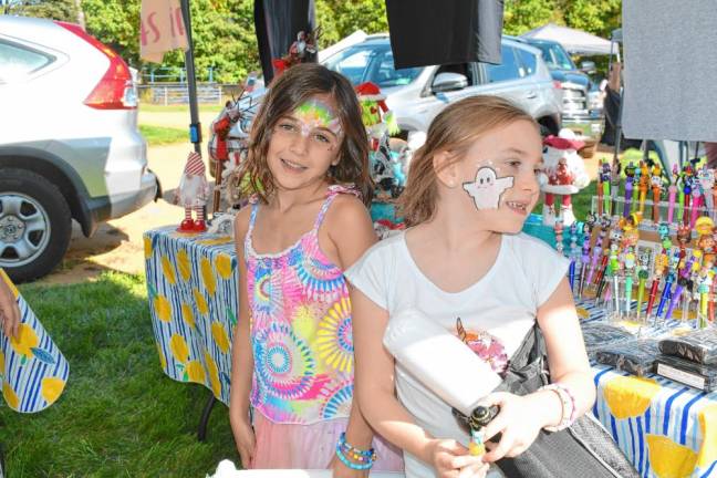 <b>SF1 Emma Vilardo and Carly Deo, both of Stanhope, show off their face tattoos at the Stanhope Fall Festival on Saturday, Oct. 5. (Photos by Maria Kovic)</b>