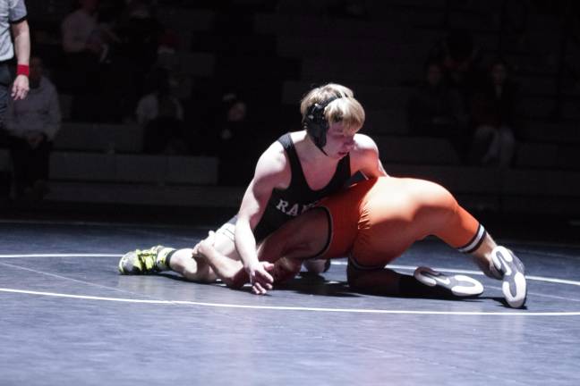 Wallkill Valley's Ethan Koger is on top of Dover's Marcos Duque in the 132-pound category. Koger won by pin.