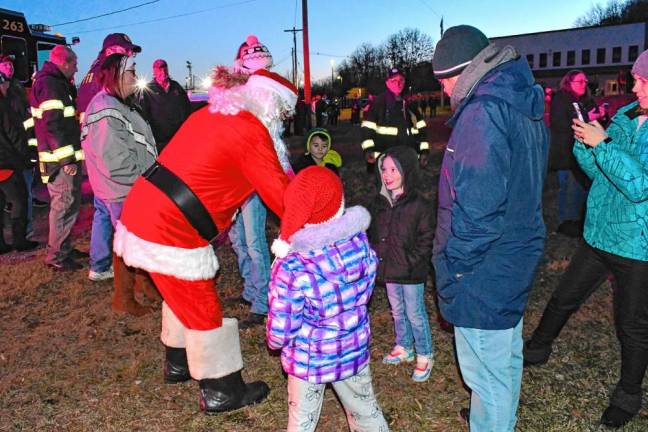 Santa greets children at the Christmas tree lighting on Saturday, Nov. 30 in Franklin. (Photos by Maria Kovic)