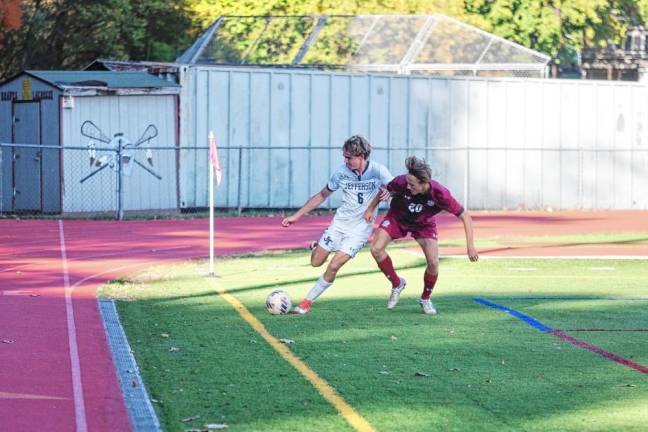 FL3 A Jefferson Falcon and a Newton Brave jostle each other while trying to get control of the ball.