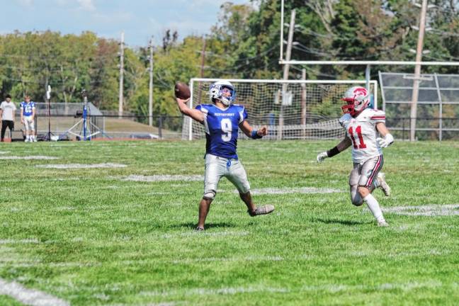 <b>Kittatinny quarterback Jack Brex throws the ball as High Point linebacker Landon Sorensen closes in during the second half</b>. Brex threw two touchdown passes.