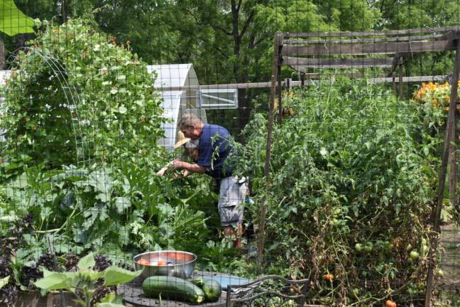 Rachel DiMartino (in hat) giving a tour of the Landmark Inn garden in Warwick, NY.