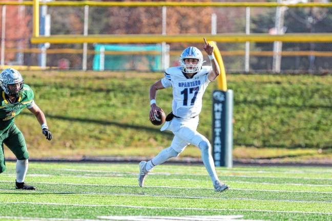 <b>Sparta quarterback Shane Hoover directs his downfield wide receiver during a second-quarter possession against Montville. (Photo by Glenn Clark)</b>