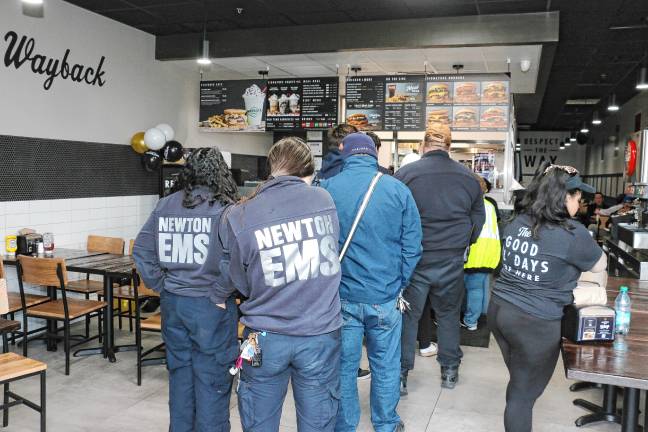 First-responders line up at the opening of Wayback Burgers.