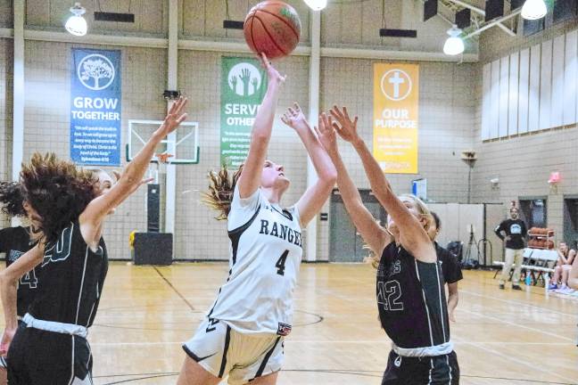 Wallkill Valley's Kate Fahrenfeld (4) takes a shot between two Veritas defenders.