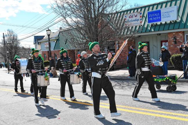 Members of the Harmony Senior Drum Corps of Boonton play as they march in the parade.