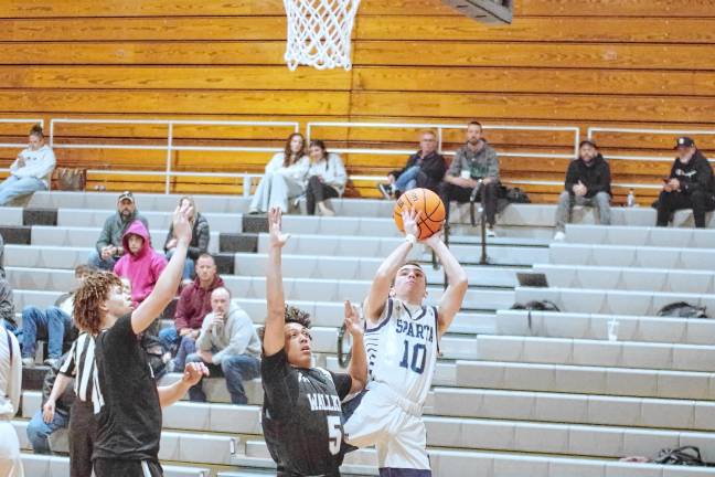 Sparta's Pat Connors handles the ball during a shot. He scored seven points.