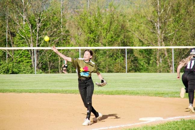 After tagging out a Wallkill Valley runner at first base, Sussex Tech infielder Courtney Lowery throws the ball toward home plate during a double-play attempt.