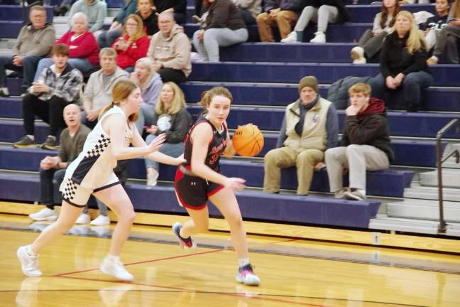 Lenape Valley's Regina Williams dribbles the ball past a Jefferson defender. She scored nine points.