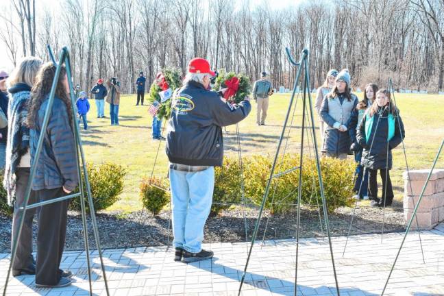 A man places a wreath during the ceremony at the Northern New Jersey Veterans Memorial Cemetery in Sparta. (Photo by Maria Kovic)