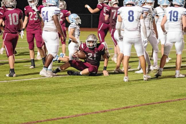 <b>Newton ball carrier Nick Kurilko begins to get up after a play. He rushed for 40 yards on 10 carries.</b>