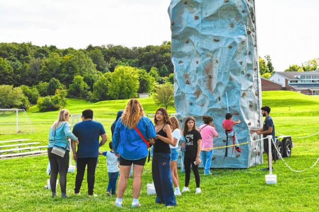 A rock-climbing wall is set up at the annual event.