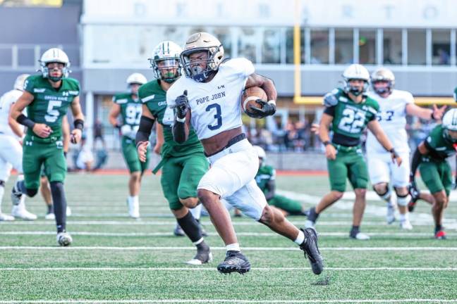 <b>Pope John’s Tylik Hill sprints toward the end zone on a first-quarter run in the game against Delbarton on Saturday, Oct. 5. Hill made three touchdowns, but the Lions lost, 35-34. (Photos by Glenn Clark)</b>