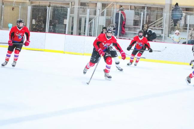 <b>High Point's Bradyn Husarenko steers the puck.</b>