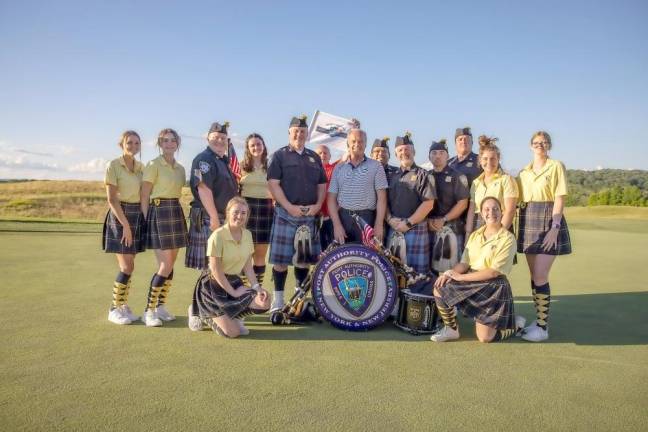 Actor Kelsey Grammer stands with the Port Authority Police Department Pipe &amp; Drum Band, who performed at the Crystal Springs Resort Law Enforcement Open on July 6.