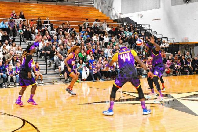 The Harlem Wizards warm up before the game.