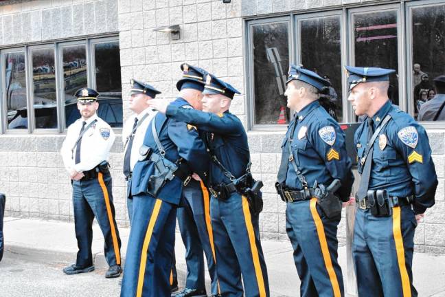 BU1 Sgt. Rafael Burgos says goodbye to his fellow officers in the Franklin Borough Police Department on Monday, Nov. 18. (Photos by Maria Kovic)