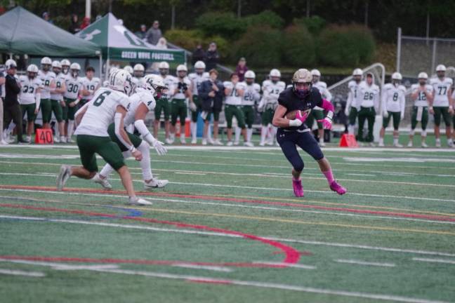 Pope John wide receiver Wesley Johnston runs with the ball in the first half.