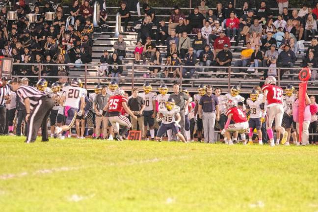 <b>After catching the ball, Vernon wideout Dean Grundy (15) looks for somewhere to run as High Point defenders approach in the first quarter. (Photo by George Leroy Hunter)</b>