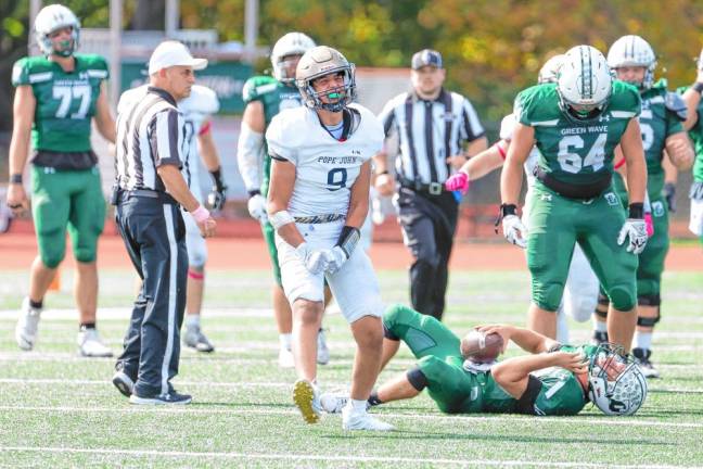 <b>Sam Conetta of Pope John celebrates his sack of Delbarton quarterback Jadon Prinzivalli in the first half.</b>