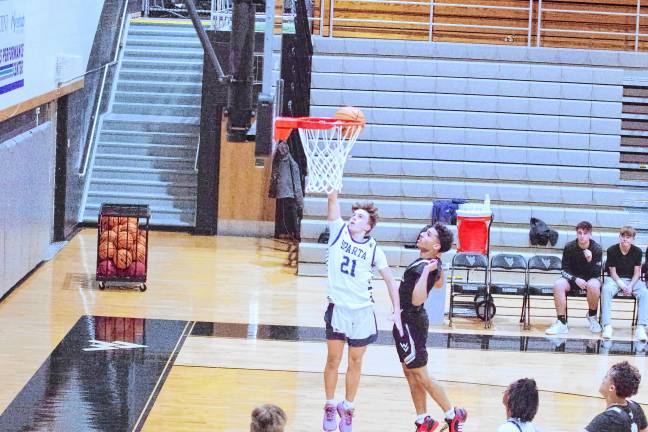 Sparta's Anthony Settembre shoots for the basket. He scored four points.