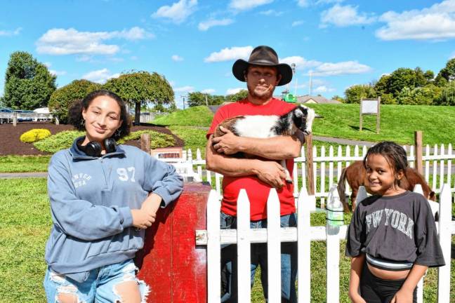 Adrianna Mays and Aubree Delvecchio, both of Saddle Brook, visit the Appalachian Animal Experience petting zoo.