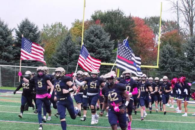 The Pope John Lions make a grand entrance onto the field.