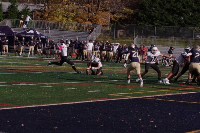 A St. Joseph kicker attempts an extra-point kick in the second half.