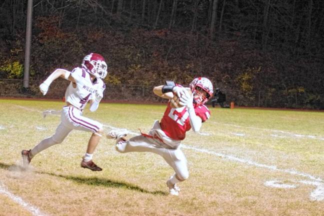 <b>HPF2 High Point wideout Brendan Lehman catches the ball while being pursued by a Becton defender in the first half. (Photo by George Leroy Hunter)</b>