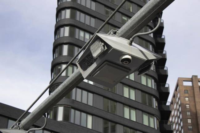 Recently installed toll traffic cameras hang above West End Ave. near 61st Street in the Manhattan borough of New York, Friday, Nov. 16, 2023. The start date for the $15 toll most drivers will be charged to enter Manhattan's central business district will be June 30, transit officials said Friday, April 26, 2024. (AP Photo/Ted Shaffrey, File)