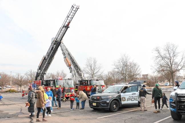 Police and fire department vehicles on display.