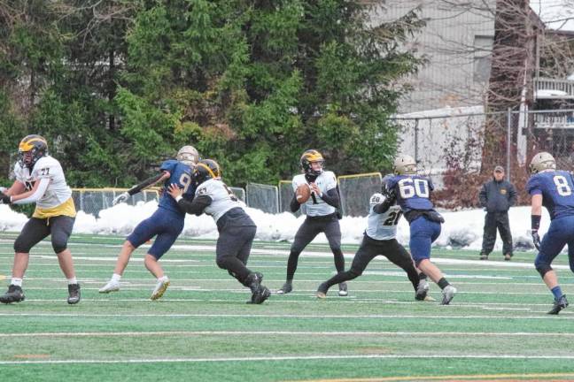 The Saint John Vianney offensive line holds back the Pope John defense to give quarterback Zach LaBarca enough time to throw the ball. LaBarca made a touchdown in the first quarter.