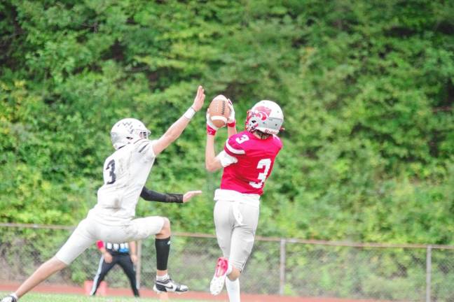 <b>Wallkill Valley defensive back Kellan Brown’s reach fails to disrupt the catch by High Point receiver Mark Leach. Leach made two receptions for 41 yards.</b>