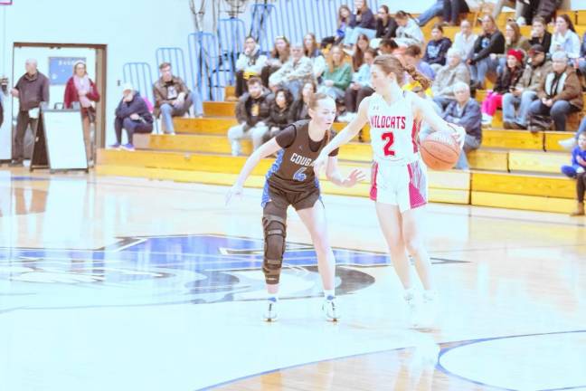 High Point's Grace Elston handles the ball while covered by Kittatinny's Katie Sajdak. Elston scored seven points.